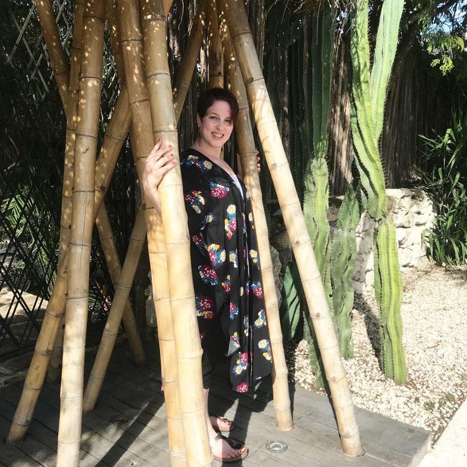 woman standing in bamboo forest
