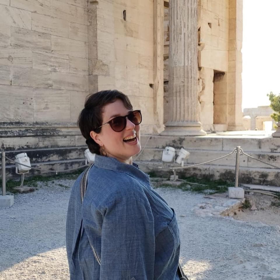 woman looking over shoulder, laughing