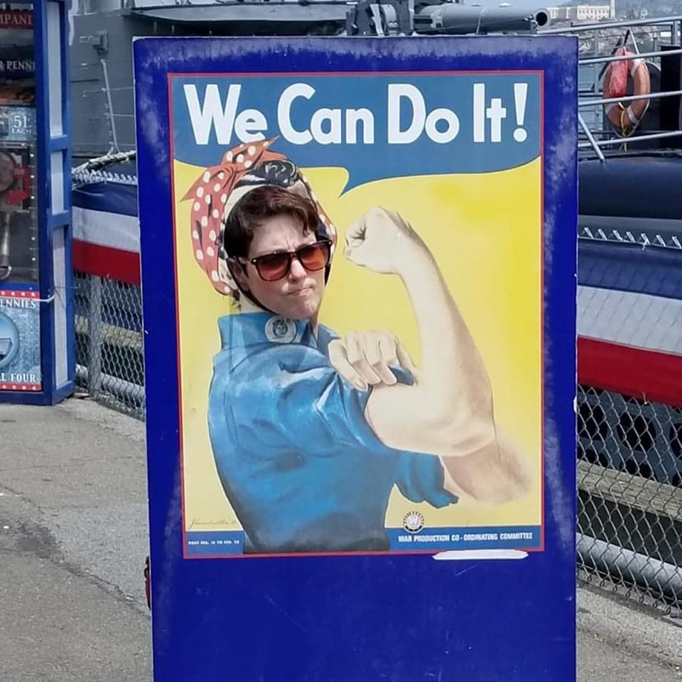 woman using Rosie the Riveter photo stand-in